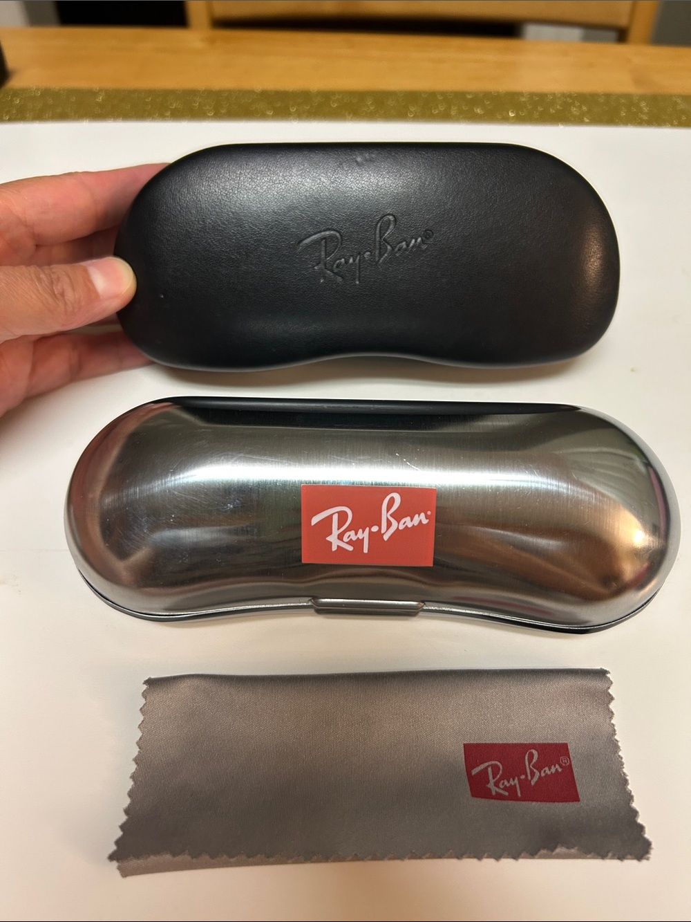 Bundle of Ray-Ban Silver Metal Case and Black Leather Case